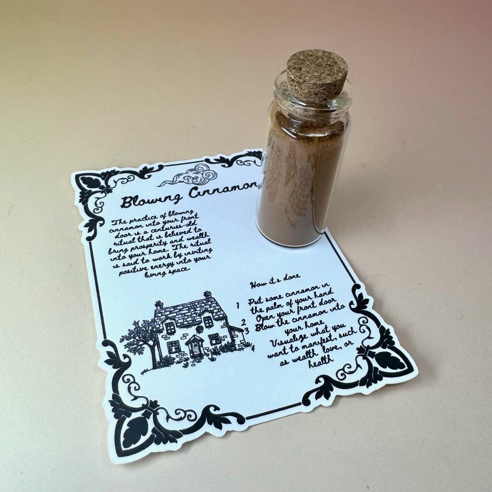 The Cinnamon Blowing Ritual Kit on a pink and yellow background.