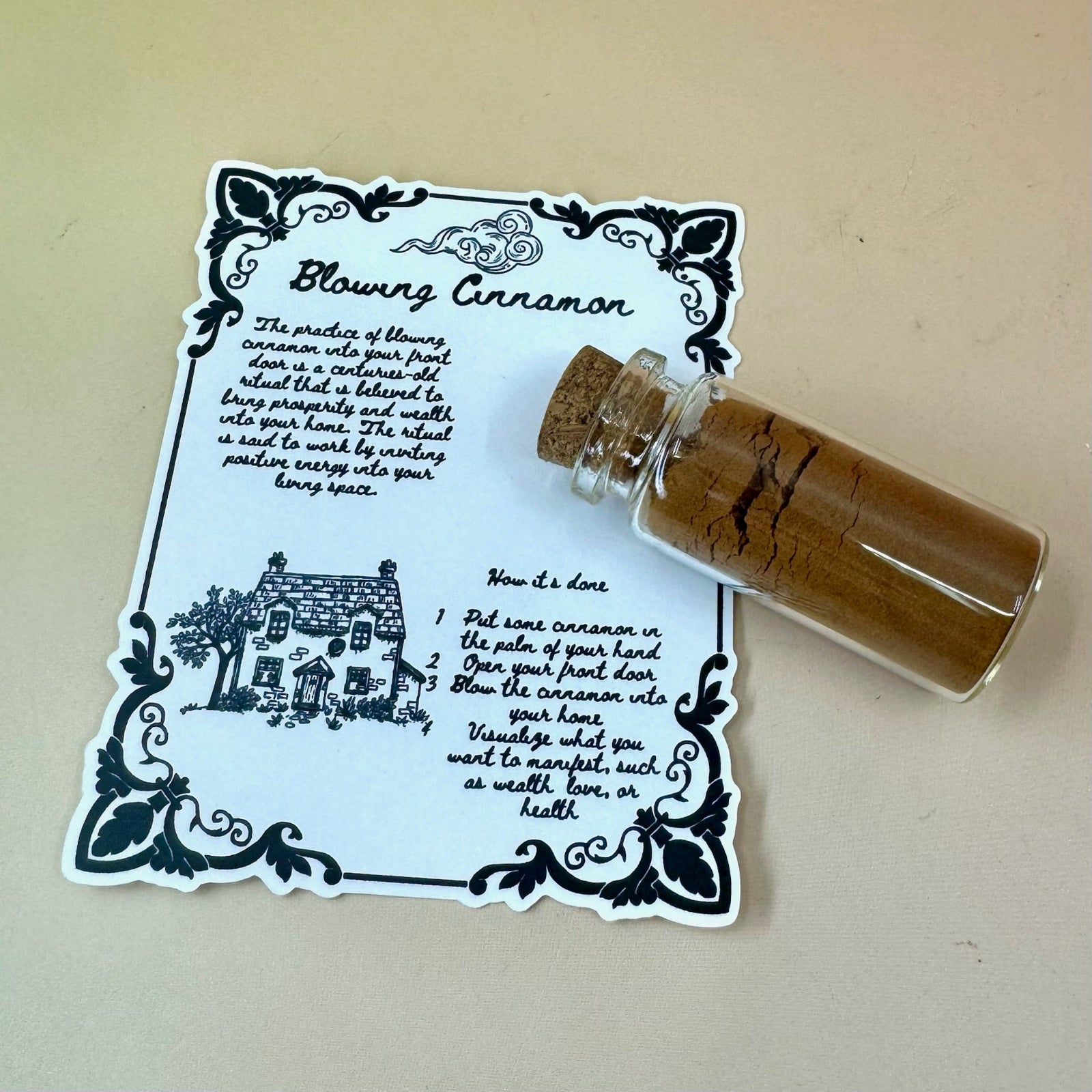 The Cinnamon Blowing Ritual Kit on a pink and yellow background.