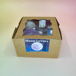 The Moon Lovers Gift Box on a pink and yellow background.
