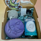 The Moon Lovers Gift Box open on a pink and yellow background.