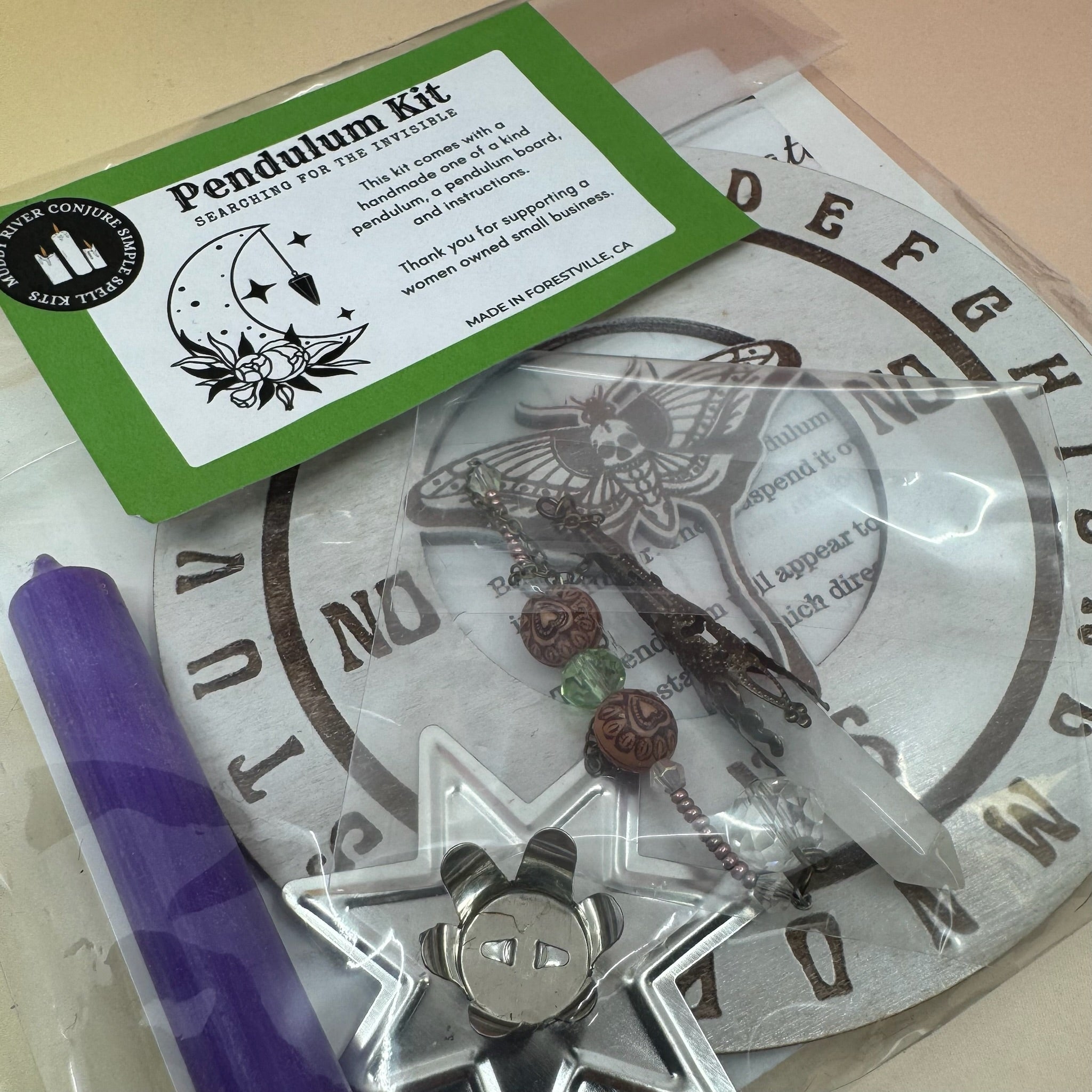 The Pendulum Kit on a pink and yellow background.