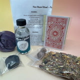 The contents of the New Moon Ritual Kit  on a pink and yellow background.