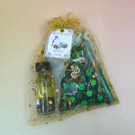 The money luck Prayer Mojo Witchy Spell Bag on a pink and yellow background.