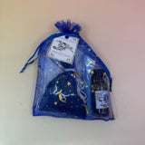 The protection Prayer Mojo Witchy Spell Bag on a pink and yellow background.