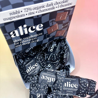 The Nightcap Single Chocolates — Mushroom Chocolates for Deep Sleep on a pink background.