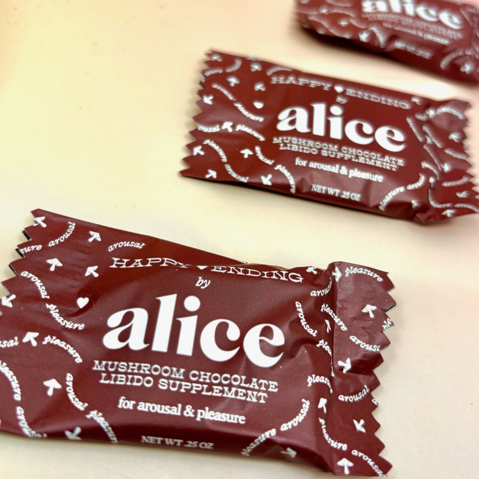 The Happy Ending Single Chocolates - Mushroom Chocolate for Arousal on a peach-colored background.