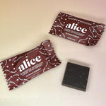 The Happy Ending Single Chocolates - Mushroom Chocolate for Arousal on a peach-colored background.