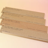All four P.F. Candle Co. incense (Amber & Moss, golden Coast, Teakwood & Tobacco, and Ojai Lavender) on a pink and yellow background.