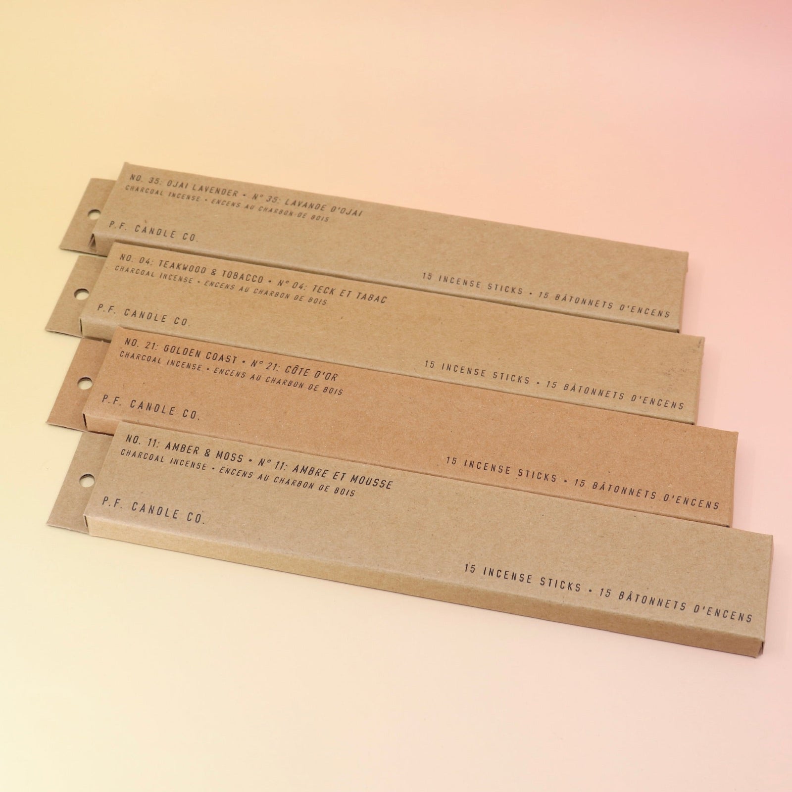 All four P.F. Candle Co. incense (Amber & Moss, golden Coast, Teakwood & Tobacco, and Ojai Lavender) on a pink and yellow background.