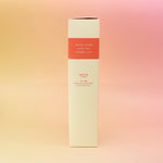 The side of the Plush Vetiver - HI-FI Reed Diffuser box all on a pink and yellow background.