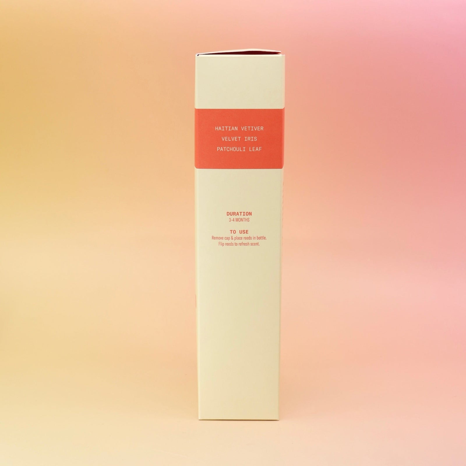The side of the Plush Vetiver - HI-FI Reed Diffuser box all on a pink and yellow background.
