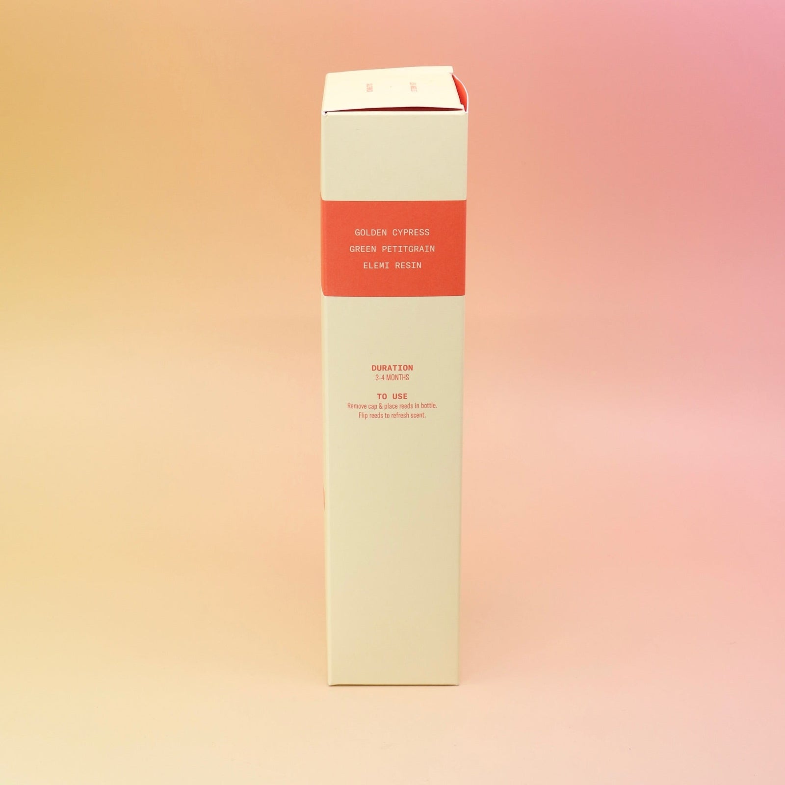 The side of the Blonde Hinoki – HI-FI Reed Diffuser box on a pink and yellow background.