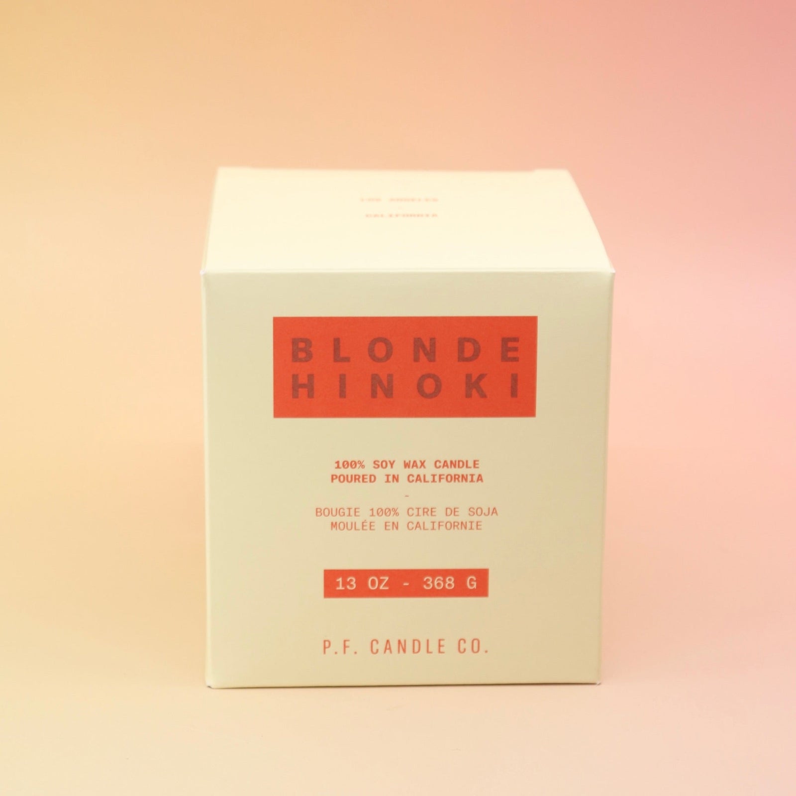 The Blonde Hinoki - HI-FI Soy Wax Candle box on a pink and yellow background.