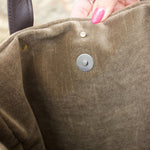 An up close image of the Geometric Velvet Tapestry Tote with Pink Faux Fur showing off the inside