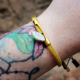 Someone wearing the Gold Mosaic Good Eye Adjustable Bracelet.