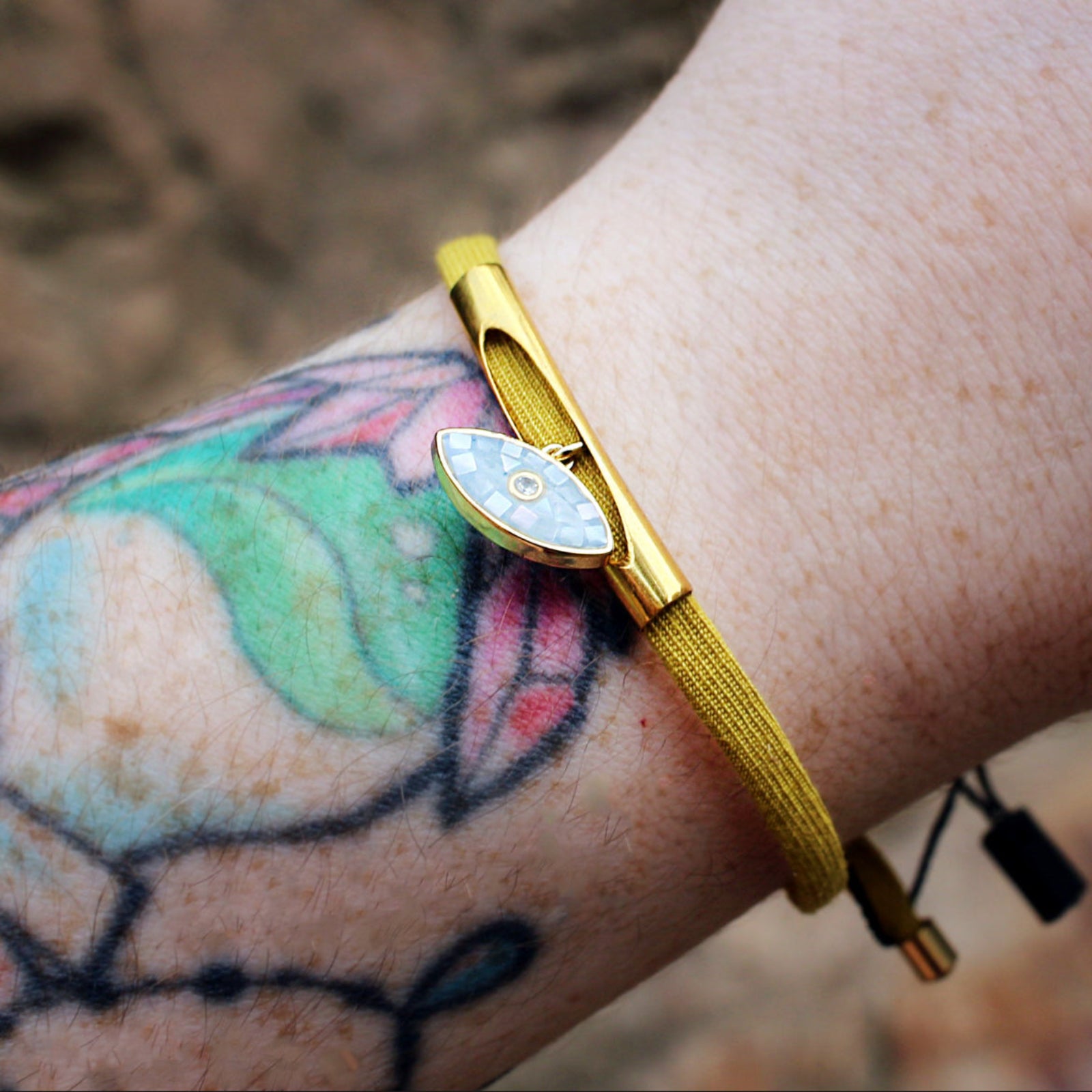 Someone wearing the Gold Mosaic Good Eye Adjustable Bracelet.