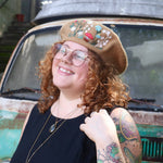 A woman wearing the beige Hand-Embroidered Floral Soft Beret Stylish Hat with a black shirt.