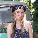 A woman wearing the red Hand-Embroidered Floral Soft Beret Stylish Hat with a black tank.