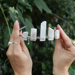 Someone holding the Fairy Crown / Celtic Tiara - Moonstone - Ice Queen in front of greenery.