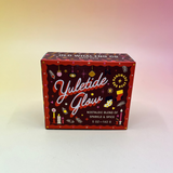 The Yuletide Glow Holiday Bar Soap in front of a pink and yellow background.