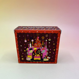 The Yuletide Glow Holiday Bar Soap in front of a pink and yellow background.