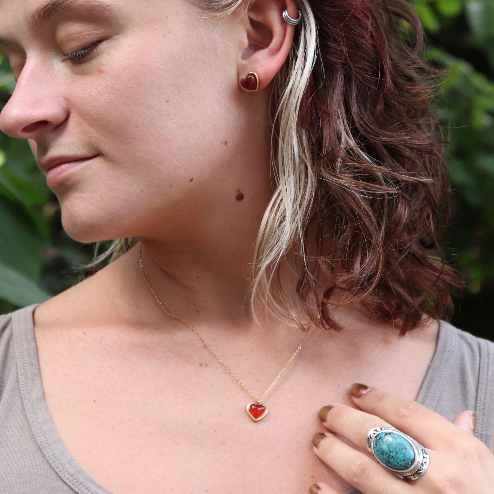 A woman wearing the gold Carnelian Earrings & Necklace Gift Jewelry Set.
