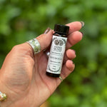Someone holding the Patchouli Pure Essential Oil.