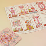 The contents of the Squid Cake Marseille Tarot Deck all on a pink and yellow background.