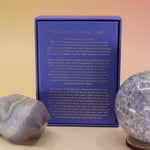 The Planet Grief Card Deck Bereavement Resource on a pink and yellow background, showing off the back.