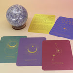 The contents of the Planet Grief Card Deck Bereavement Resource on a pink and yellow background.