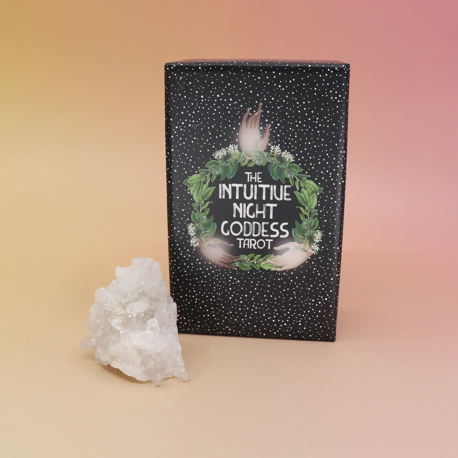 The Intuitive Night Goddess Tarot Deck on a pink and yellow background.