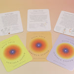 The contents of the Hack Your Nervous System card deck on a pink and yellow background.