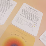 The contents of the Hack Your Nervous System card deck on a pink and yellow background.