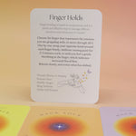 The contents of the Hack Your Nervous System card deck on a pink and yellow background.