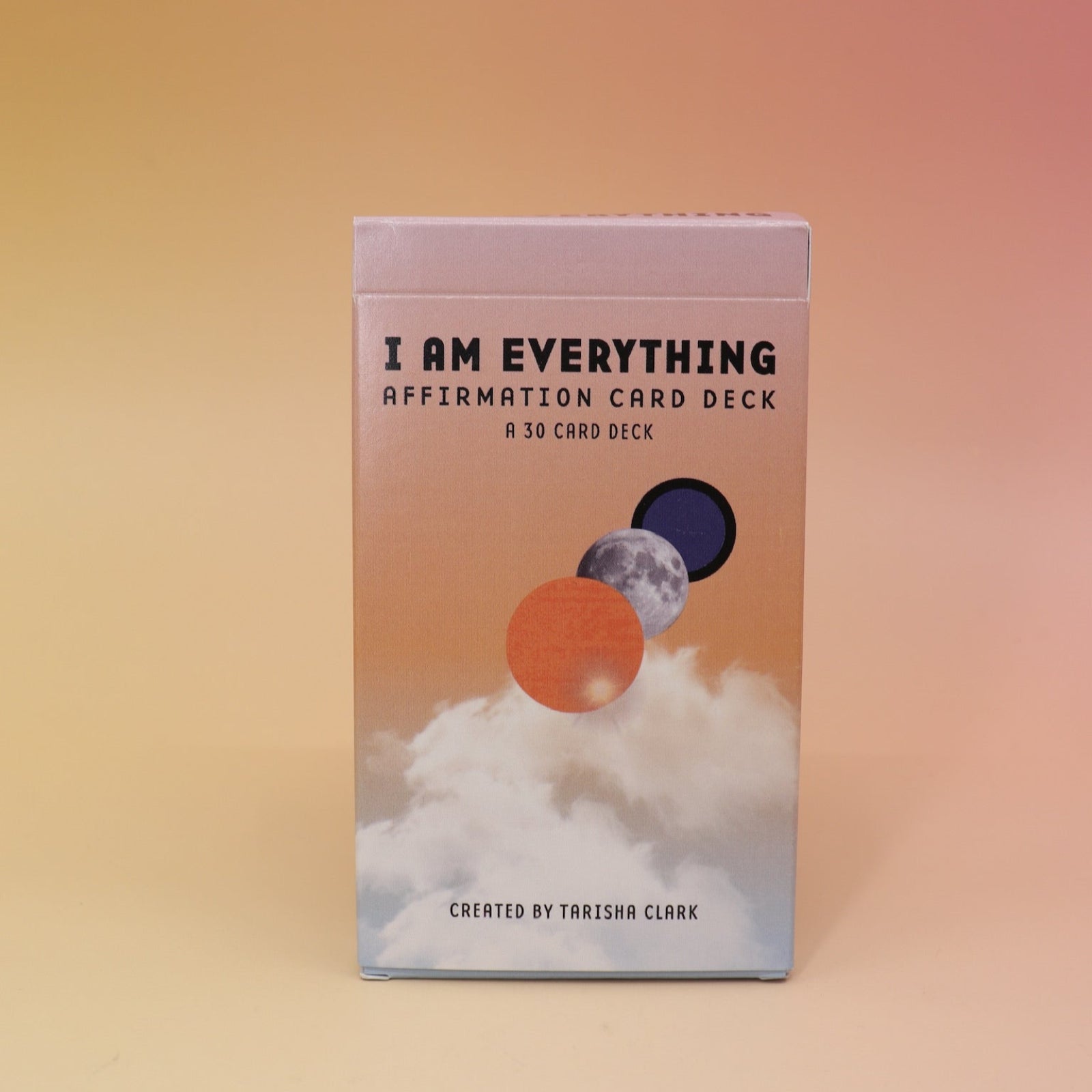 The Affirmation Card Deck on a pink and yellow background.