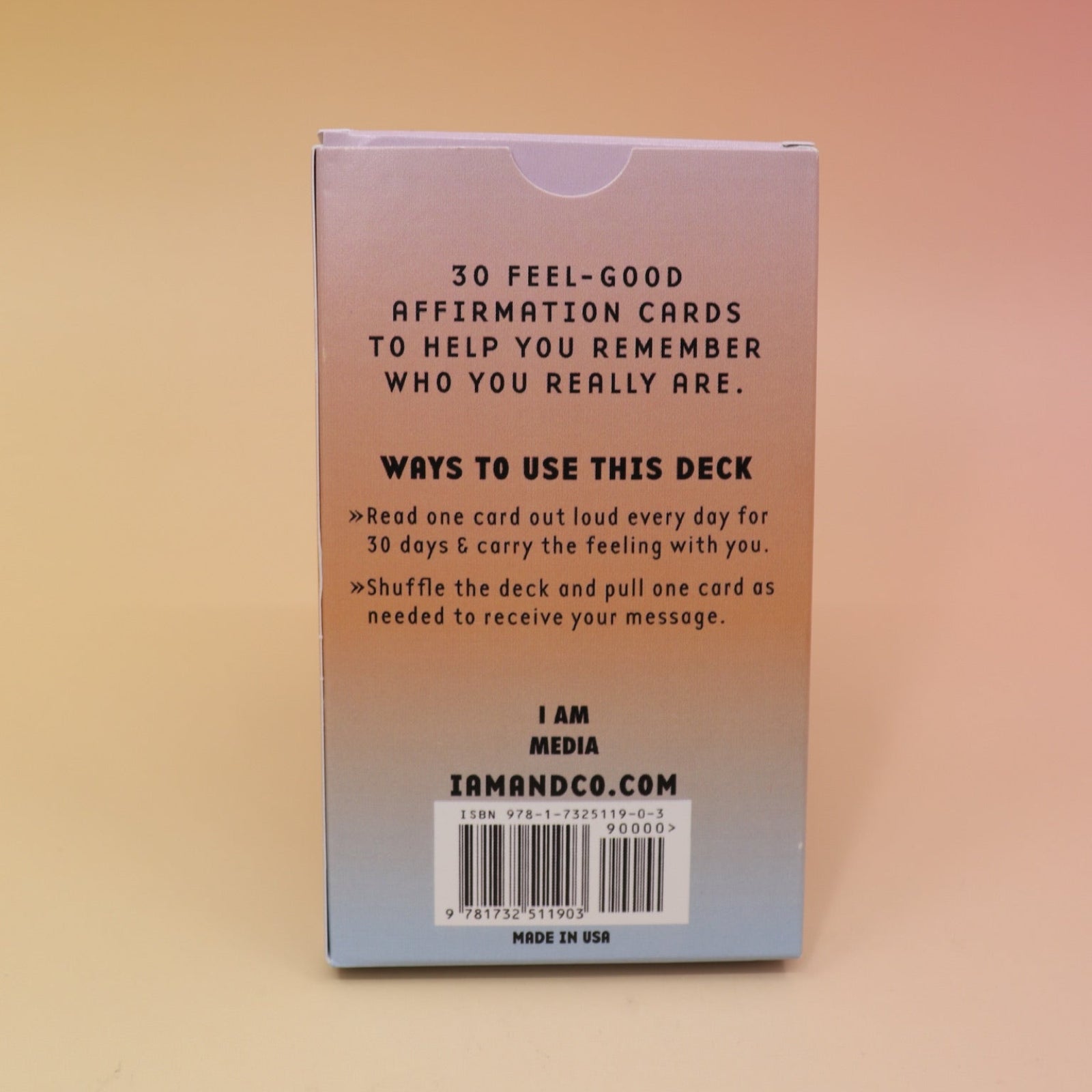 The back of the Affirmation Card Deck on a pink and yellow background.