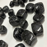 Close-up of large Indigo Gabbro tumbles showing natural swirling patterns