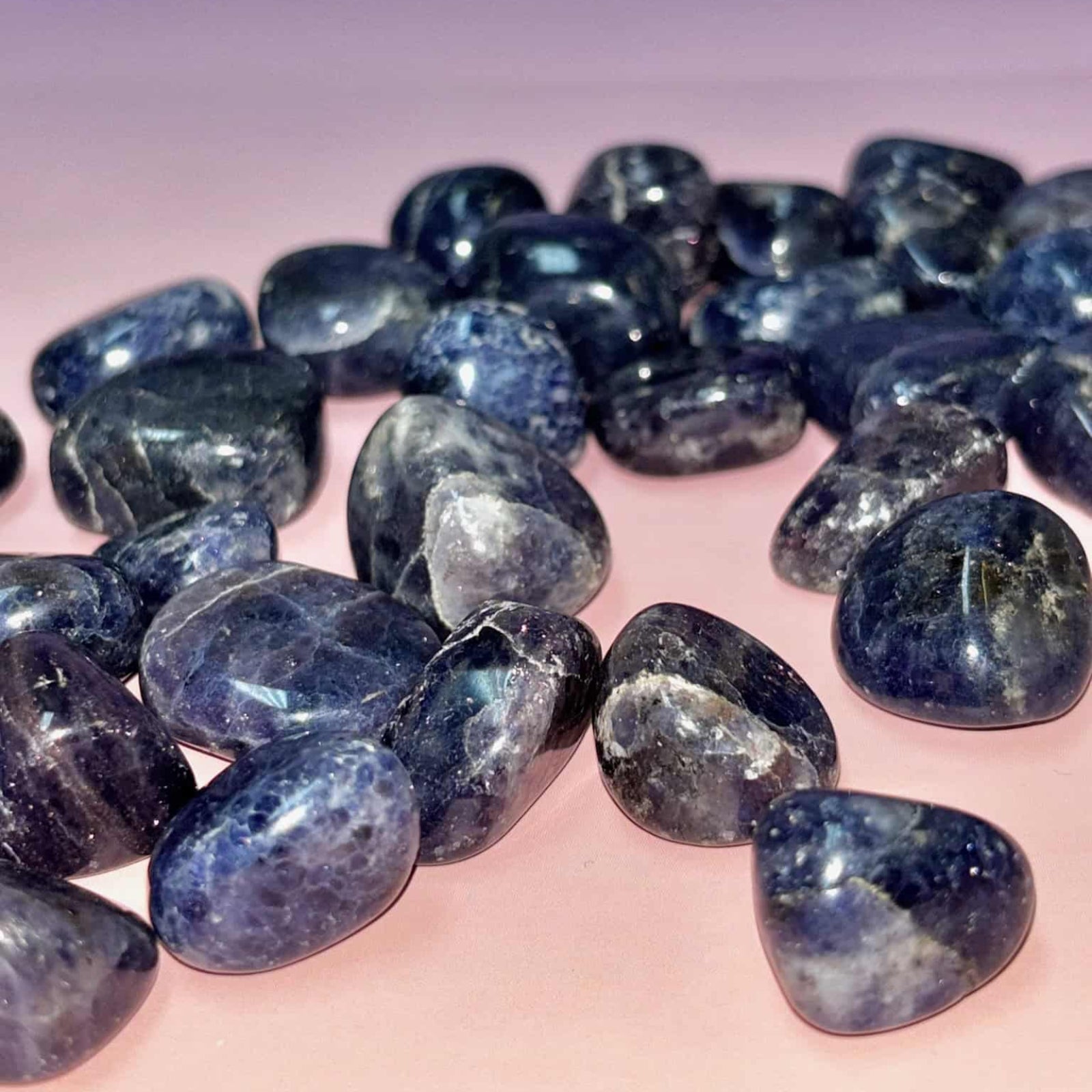 Collection of blue stones on a gradient background