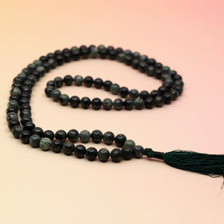 Kambaba Jasper 108 Mala Necklace on pink and orange background