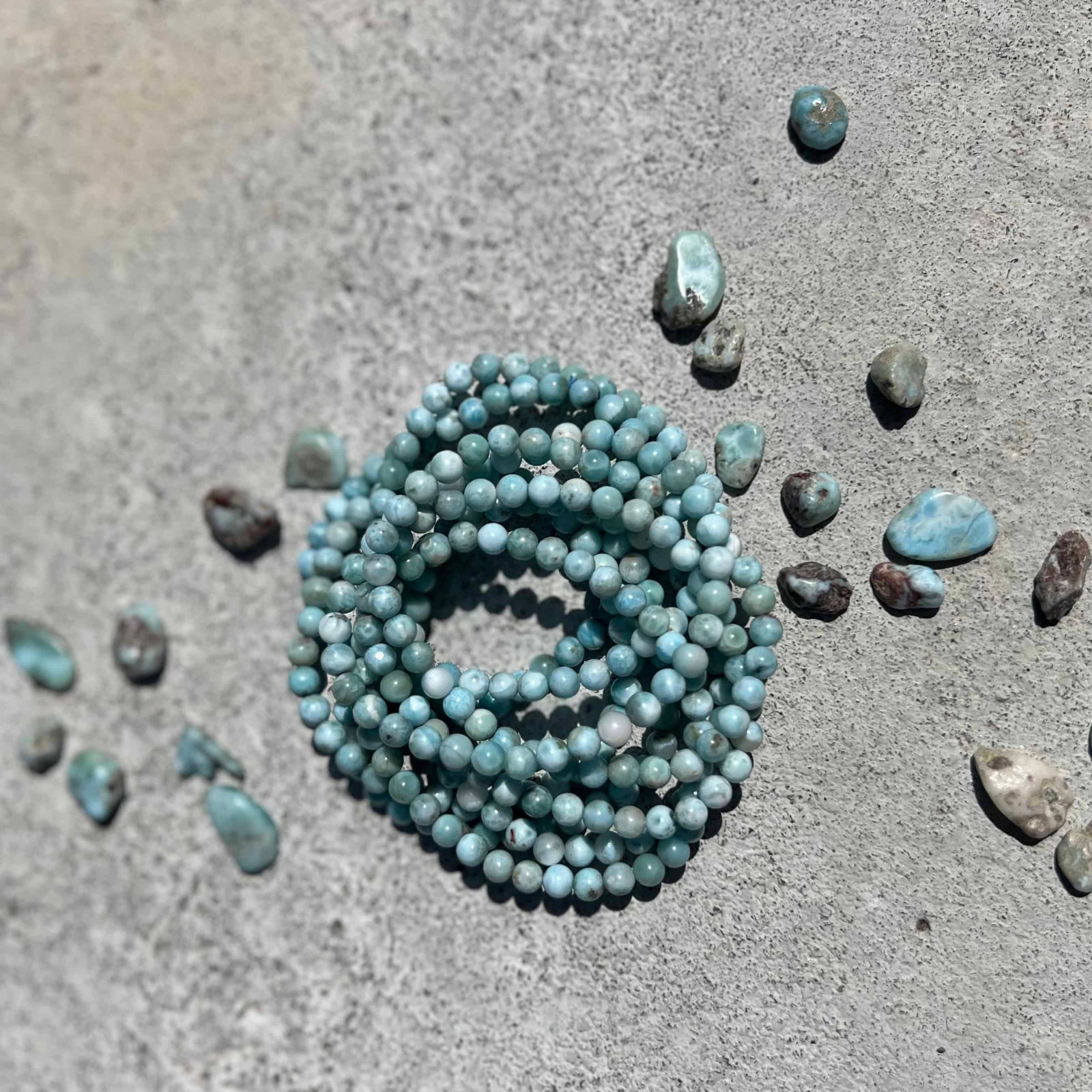 Larimar stone bracelet on a gray surface