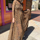 leopard mesh dress on model standing in front of orange and pink building