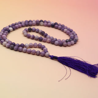 Lepidolite 108 Mala Necklace on pink and orange background