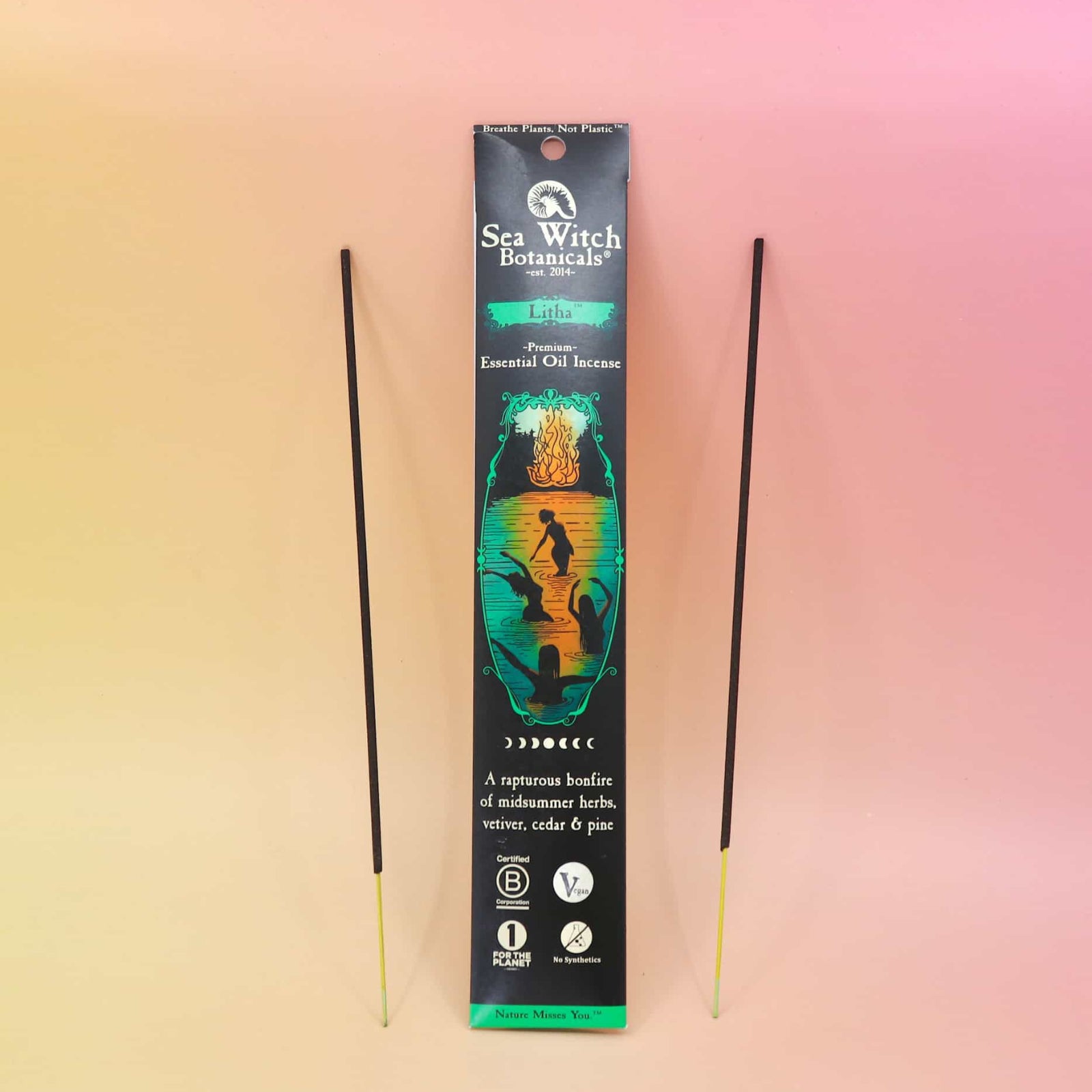 pack of incense with 2 sticks on either side on an orange and pink background