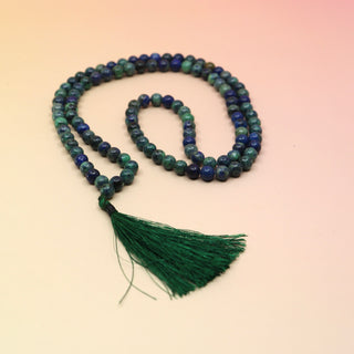 Malachite and Azurite Mala Necklace on orange and pink background