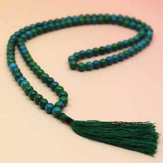 Malachola 108 Mala Necklace on pink and orange background
