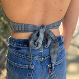 Model wearing blue floral halter top with back tie - Midnight Floral Top look from back at halter tie