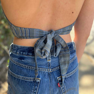Model wearing blue floral halter top with back tie - Midnight Floral Top look from back at halter tie