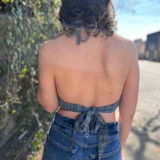 view from back Model wearing blue floral halter top with back tie - Midnight Floral Top