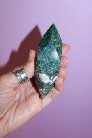 Moss Agate Prism on pink background