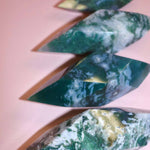 Moss Agate Prism on pink background